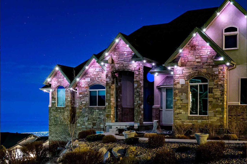 Attached image file A house with lights on it.